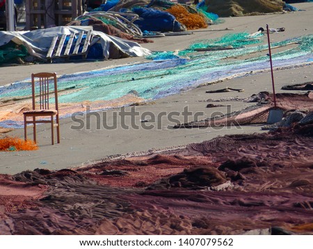Fishing nets of different colors above the ground