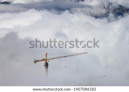 Big crane on top of Fansipan (the highest mountain in Indochina, at 3,143 meters) Vietnam, during cable car construction