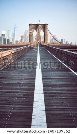 Brooklyn Bridge at sunrise, color toning applied, New York City, USA.