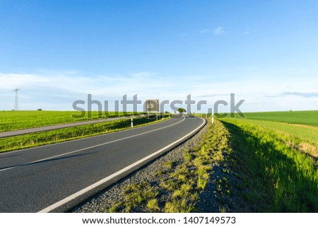 Empty highway at blue sky