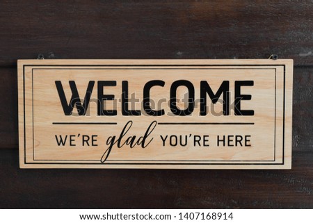 Welcome Label on wood and restaurant