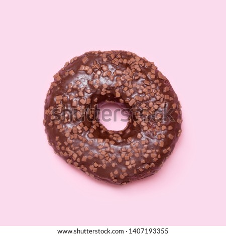 Chocolate donut on pimk background