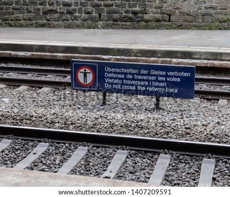 Crossing the tracks prohibited, warning sign



