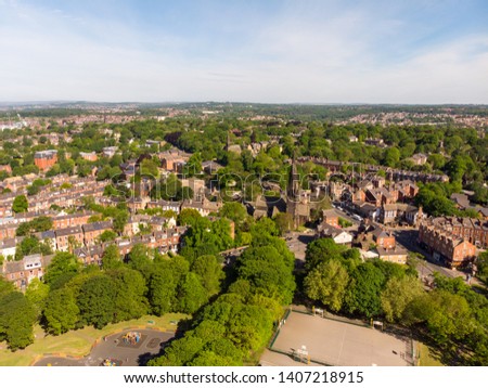 Aerial photo of the town known as Headingley in Leeds West Yorkshire, you can see local businesses and the typical British roads in the town centre and also the park and skate park with trees.