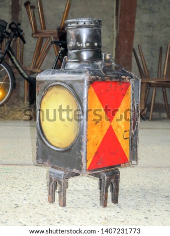 Old railway lantern in the attic                            