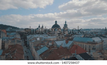 Lviv, Ukraine. March 20, 2019: Aerial Roofs and streets Old City Lviv, Ukraine. Dominican Church. Central part of old city. European City. Popular areas. Panorama of the ancient town. Rooftops