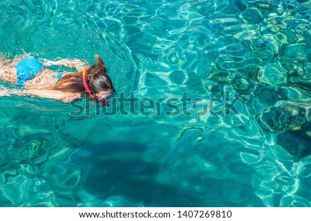 summer vacation concept photography of swimming and snorkeling girl model in transparent vivid blue water tropic natural ecology luxury environment, wallpaper pattern picture with empty copy space