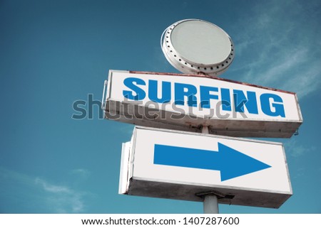 Aged and worn vintage surfing sign                              