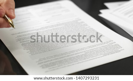 Businessman holding pen signing agreement, making deal, real estate rent, credit