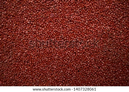 Dry red corn kernels texture background, close-up, top view. Sweet red corn seeds as agriculture and farming concept 