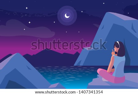 woman seated observing nightscape with lake