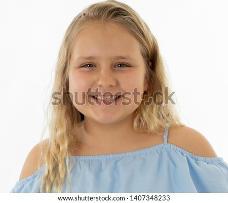 Close up portrait. Cute happy, confident, successful, proud little girl smiling at the camera. Positive human emotions and facial expressions, education and happy childhood concept.