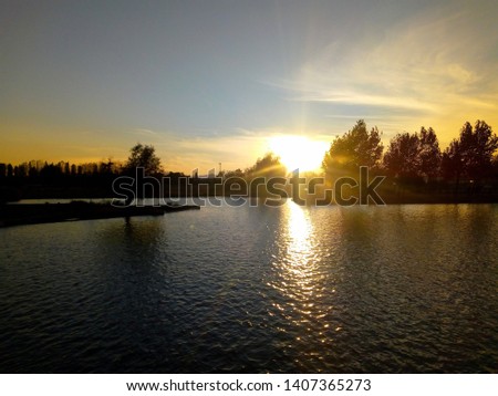 Sunset in the bicentennial park of Cerrillos, Santiago de Chile.  Royalty-Free Stock Photo #1407365273