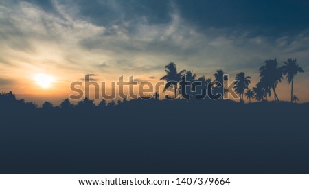 Happy Parents and Daughter are traveling on natural scenery at sunsetn in thailand.Family concept