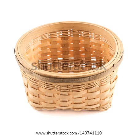 Wooden round wicker basket isolated over white background