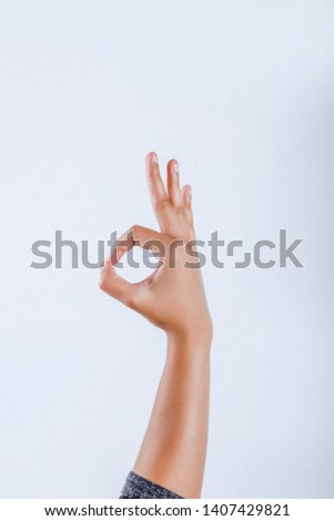 Human Hand showing Ok Gesture