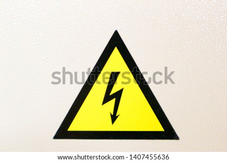yellow high voltage warning sign on white background