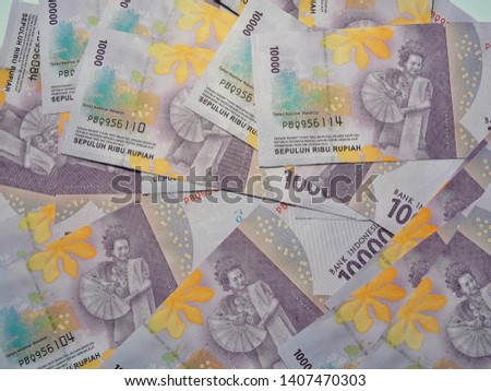 Indonesian rupiah banknotes series with the value ten thousand rupiah IDR 10000. Indonesian currency background
