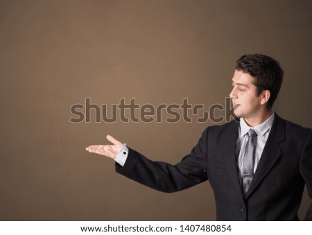Young person presenting something with empty space