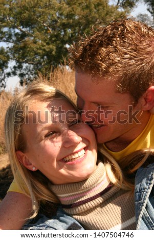 Young beautiful couple in love, man and woman on vacation in forest in South Africa, love, pre-wedding photo shoot.