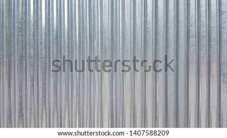White Corrugated metal or zinc texture surface or galvanize steel in the vertical line background or texture Royalty-Free Stock Photo #1407588209
