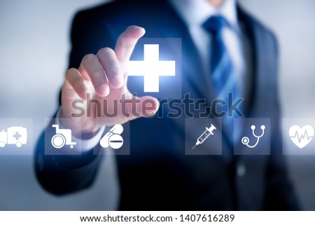 Health insurance concept, Businessman holding Healthcare Medical icon