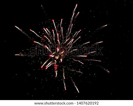 Beautiful sparks from fireworks in the sky at night.