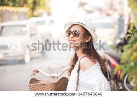 Asian woman tourist walking on the Thai street