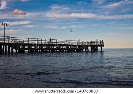Sunrise on the pier at the seaside, Gdynia Orlowo, Poland. Baltic Sea. Long exposure photography