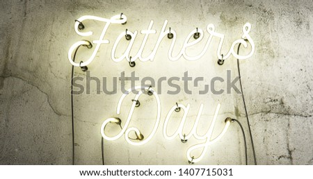 Fathers day white neon sign on a concrete grunge wall.