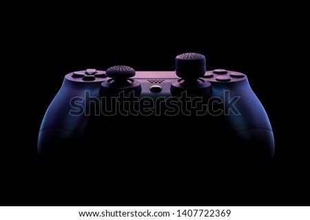 Console gamepad, game controller on black background, under specially designed pink and purple lighting. Close up studio shot