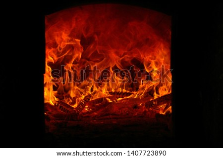 The blazing log fire, enjoying the experience