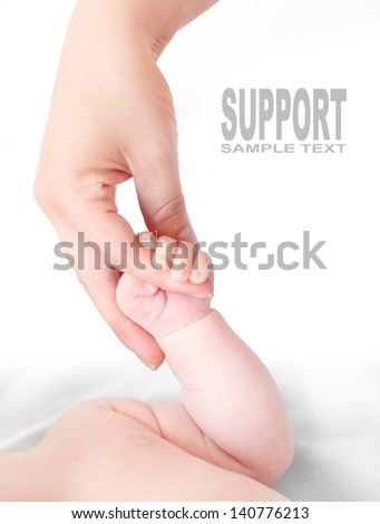  Helping hand. Funny picture of mothers and baby hand.