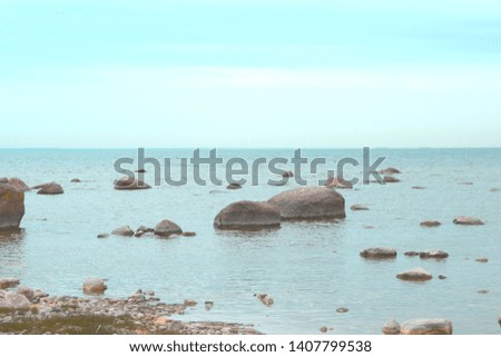 landscape with sea, blue sky and stones