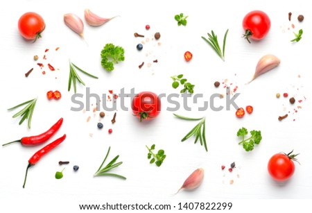 Ingredients and spices for cooking homemade pizza on white wooden background. Top view. 