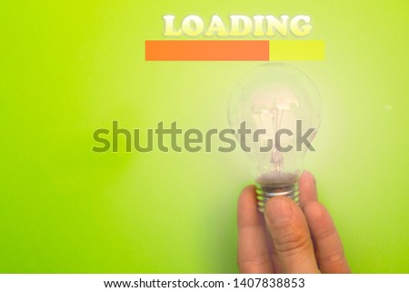 Hand holding the light bulb, concept of startup, idea and creativity.