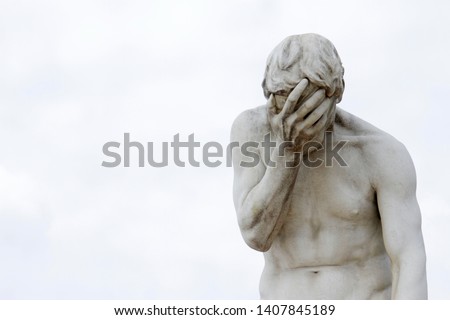 Facepalm - ashamed, sad, depressed. Statue with head in hand Royalty-Free Stock Photo #1407845189