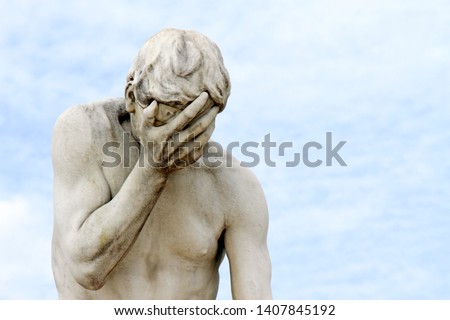 Facepalm - ashamed, sad, depressed. Statue with head in hand Royalty-Free Stock Photo #1407845192