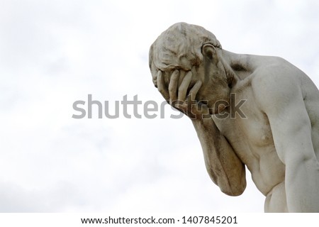 Facepalm - ashamed, sad, depressed. Statue with head in hand Royalty-Free Stock Photo #1407845201