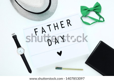 Lightbox with words Father Day and accessories on white background