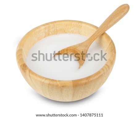 Coconut Milk in wooden bowl isolated on white background