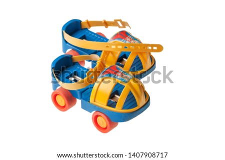old style plastic roller skate isolated on white