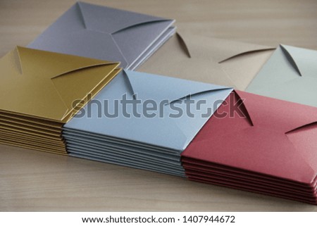 Multi-colored envelopes on the light table