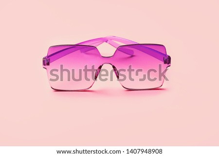 modern style Pink acrylic sunglasses close up on abstract pink background. Creative fashion minimal concept. copy space. element for design