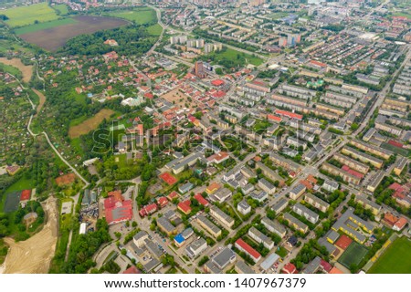 The city, buildings and blocks and trees - aerial view.