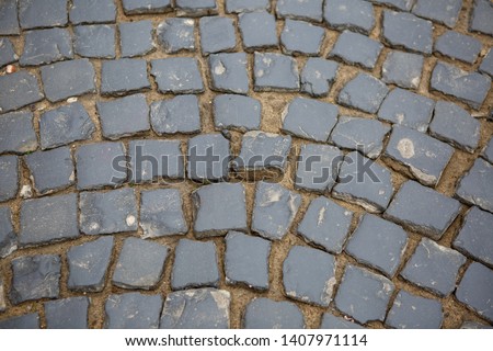 Material for sidewalk. Grey paving stone. Background