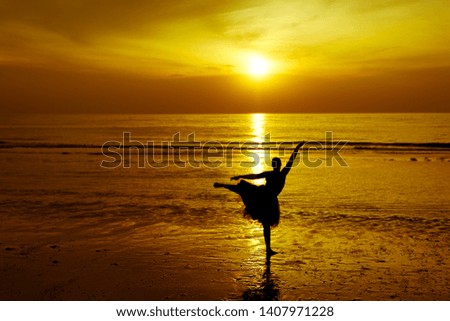 a dancer on the beach during sunset