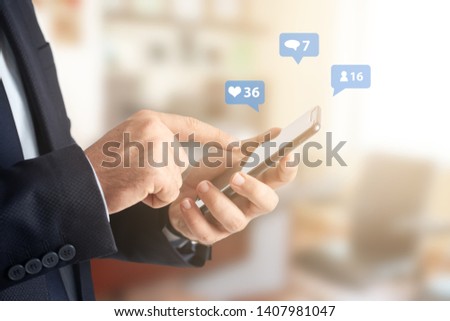 Close-up image of businessman hands using smartphone at office, searching or social networks concept