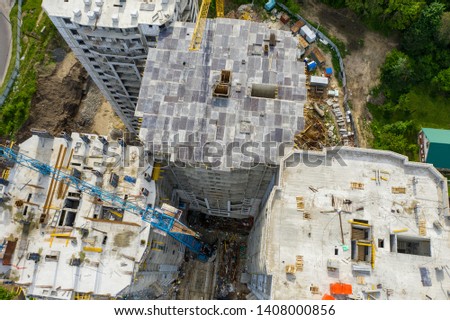 Aerial view of construction site of new modern apartment residential building, drone photo, top view.