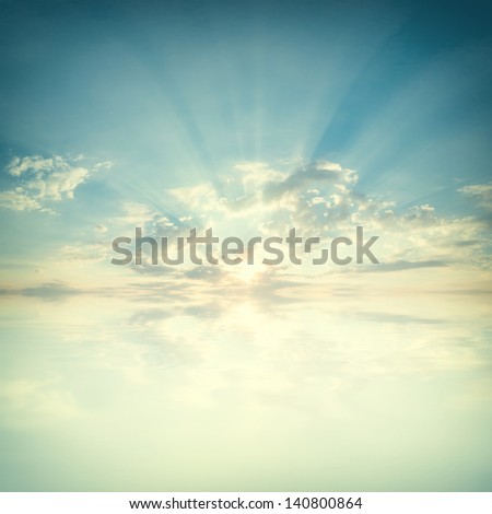 Blue sky with clouds and sun reflection in water with place for your text Royalty-Free Stock Photo #140800864